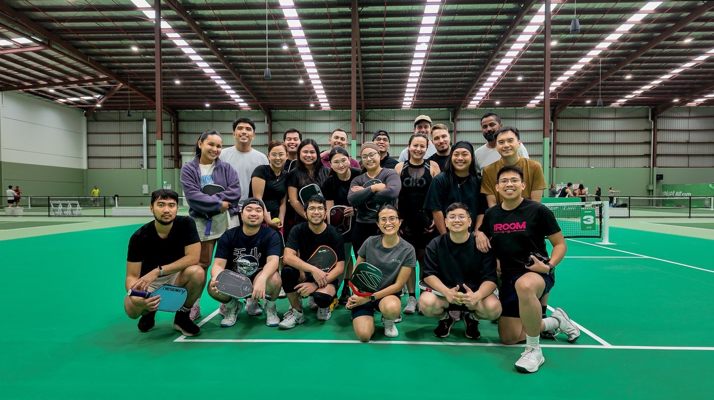 A big Kitchen Club group photo on court
